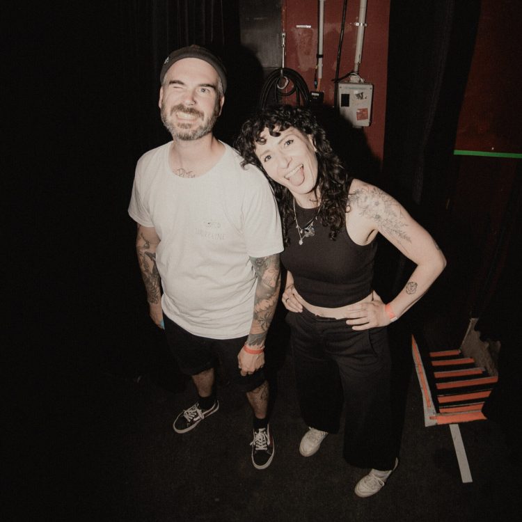 Two members of Melonball looking into the camera smiling.